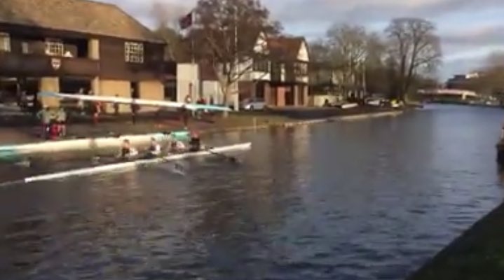Four rowing on the river