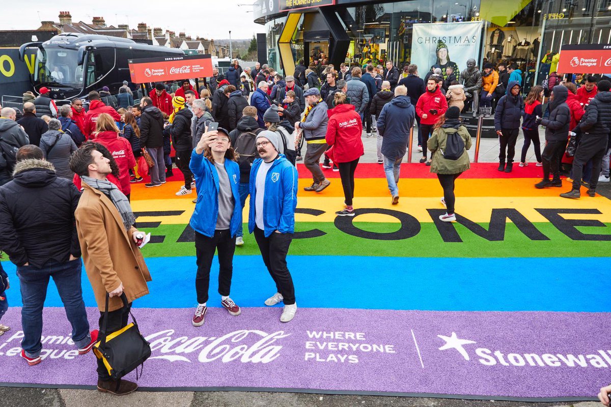 CocaCola_GB's tweet photo. Everyone is welcome in the @premierleague. Enjoy the football and look out for our welcome mats and #RainbowLaces outside stadiums this weekend! #WhereEveryonePlays https://t.co/HtR79hfaEH