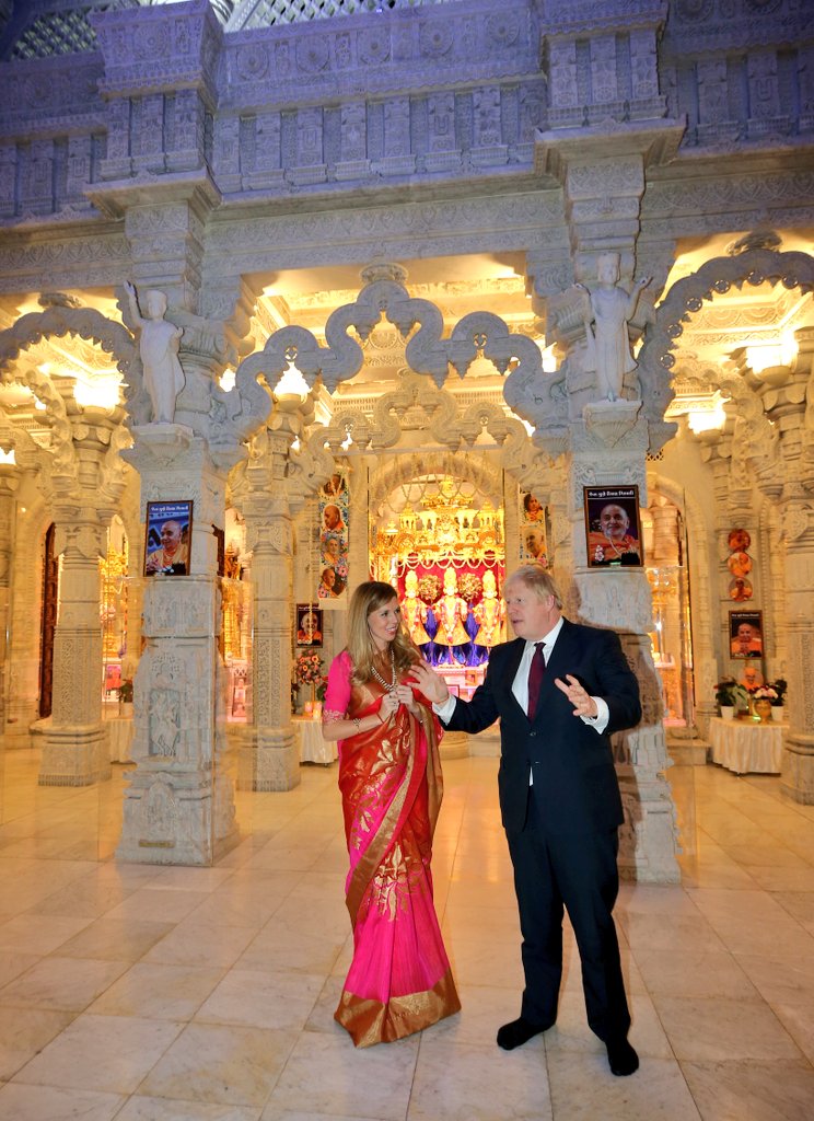 BhavikPrit's tweet photo. UK Prime Minister @BorisJohnson MP and Home Secretary Priti Patel @patel4witham at Swaminarayan @NeasdenTemple on the auspicious occasion of His Holiness #PramukhSwami Maharaj’s 98th birthday celebrations!! #psm98 https://t.co/0LwAC1eIgV