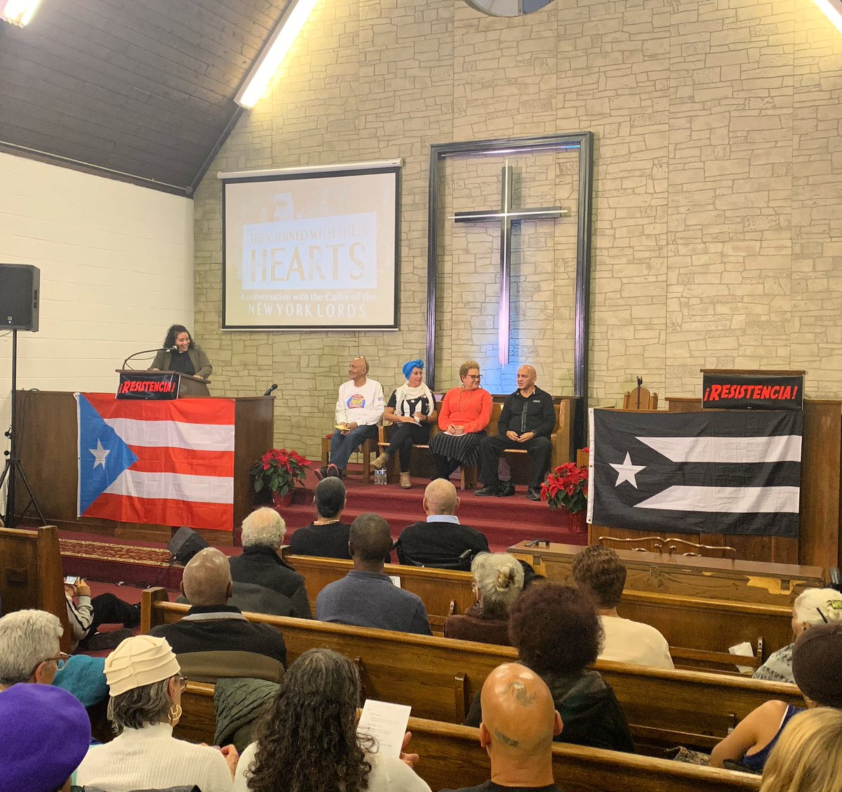 YoungLords50NY's tweet photo. Our panel begins, moderated by Rev. Dorlimar Lebrón Malavé, with Gilbert “Sabu” Colón, Minerva Solla, Gloria M. Rodriguez, and Sifu Jose “Pai” Diaz. 

#YoungLords50NY https://t.co/h0rDkS9rCQ