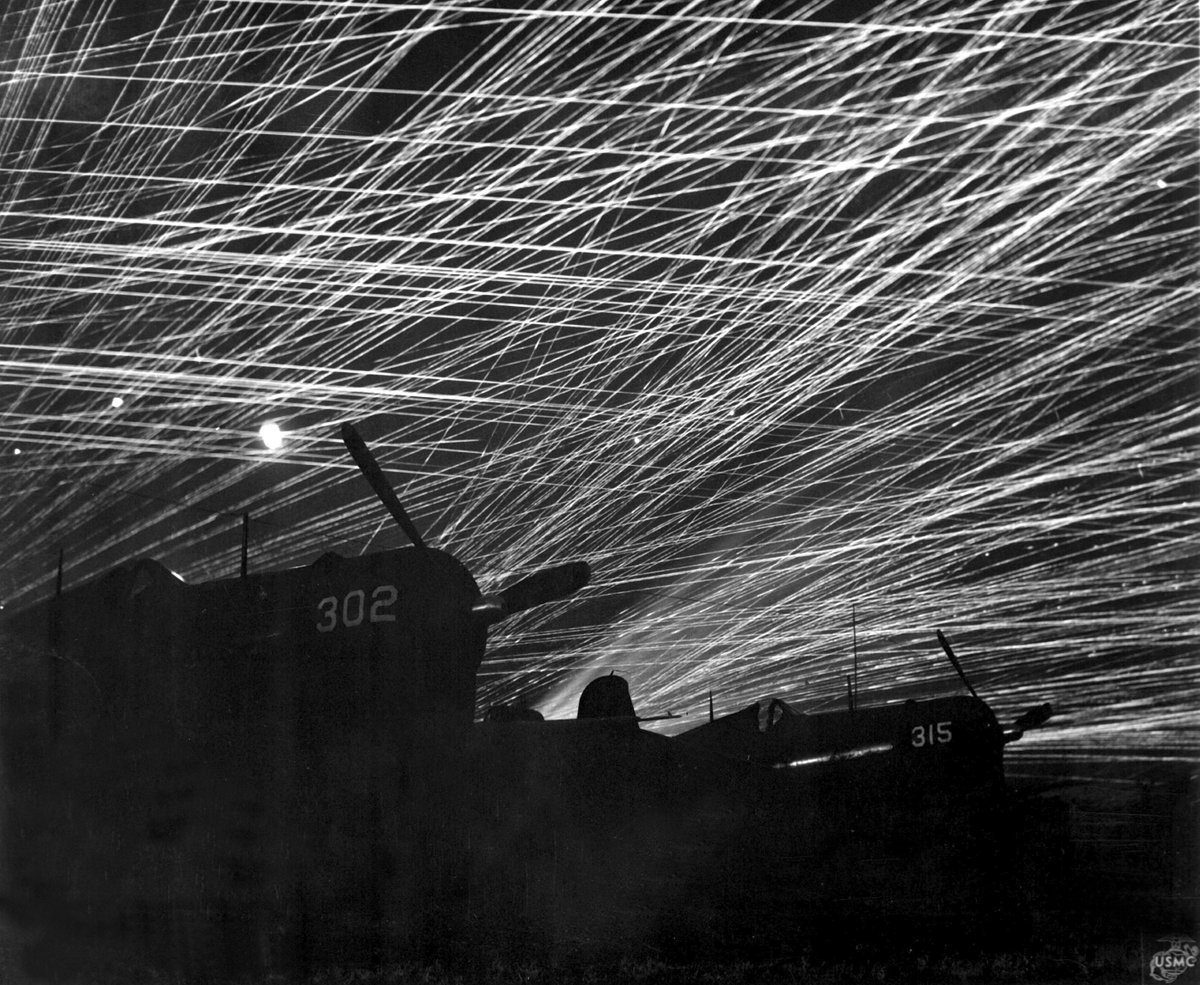 #Japanese night raiders are greeted with a lacework of anti-aircraft fire by the Marine defenders of #Yontan airfield on #Okinawa, 1945.

#WW2 #WWII