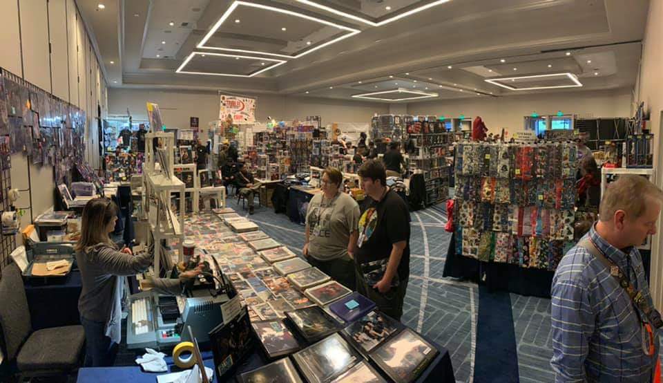 EmpireConLA's tweet photo. The Empire Con bazaar is buzzing! Stop by to visit our lovely selection of wares, costume groups, and guest artists, as well as the Peter Mayhew Foundation booth! Truly a hive of both swag and villainy!
#EmpireCon
https://t.co/RLx55ouHGw https://t.co/bs7Q6pzx8p