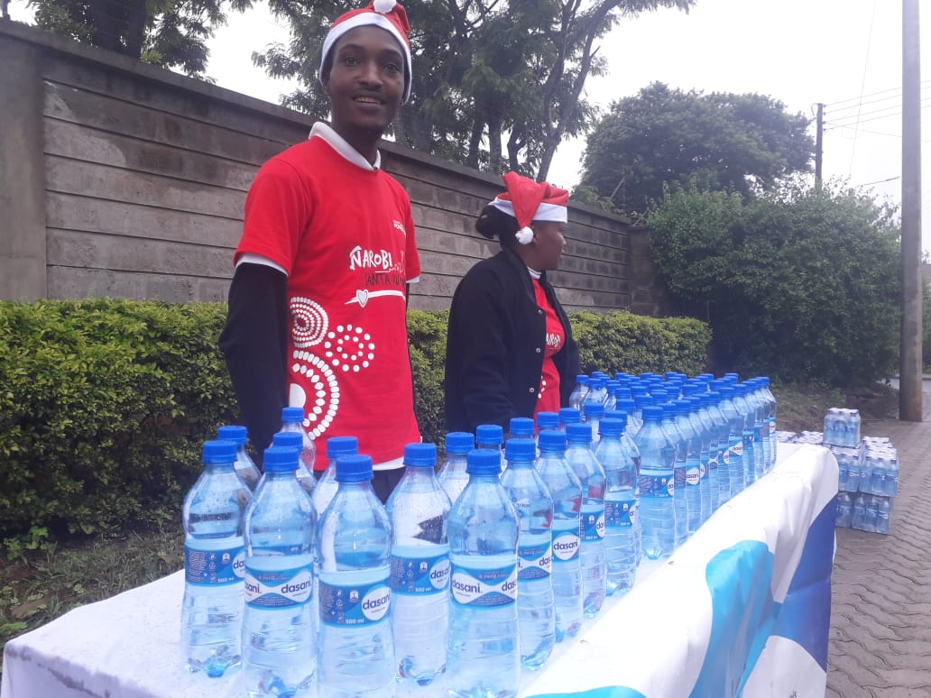 IconSportsKE's tweet photo. Hydrating runners at the just concluded #santarun at Two Rivers Mall #TeamIconSports #DasaniKE https://t.co/hi4FdtXHqW