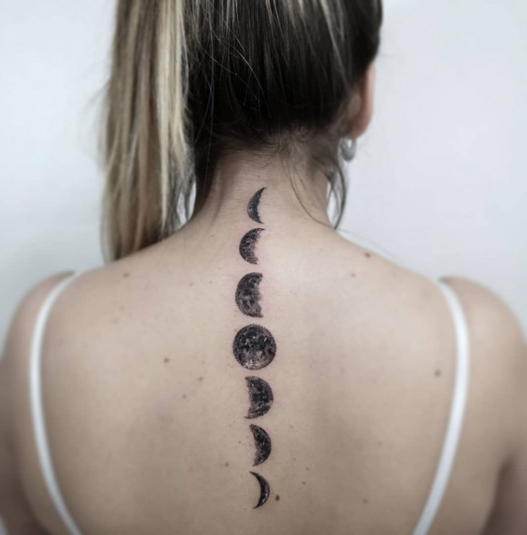 Moon phase tattoos in the spine