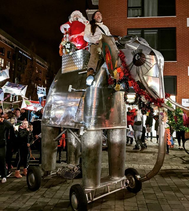 Father Christmas inexplicably arriving on a wheeled elephant and yelling his head off at people in the crowd (perhaps he had a little #WoolwichWinterWarmer before he mounted up?) instagram.com/p/B5znFCjJceI/