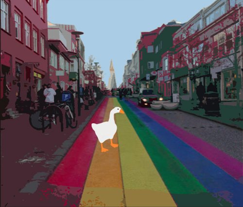 Goose in downtown Reykjavik on the road painted in rainbow colors.