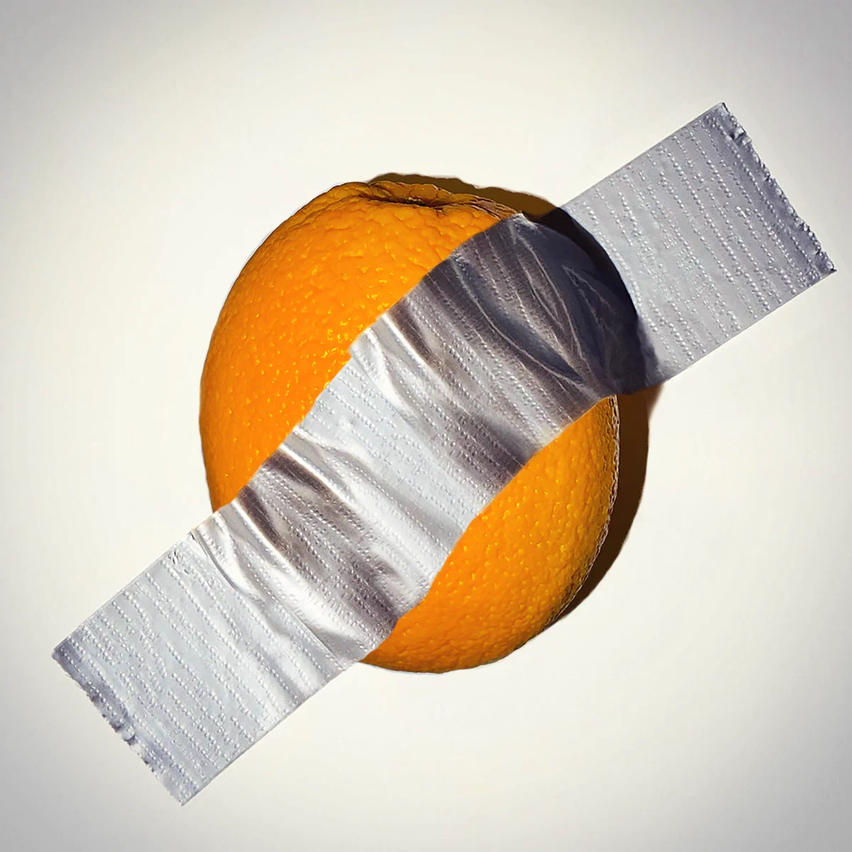 Orange duck taped to wall