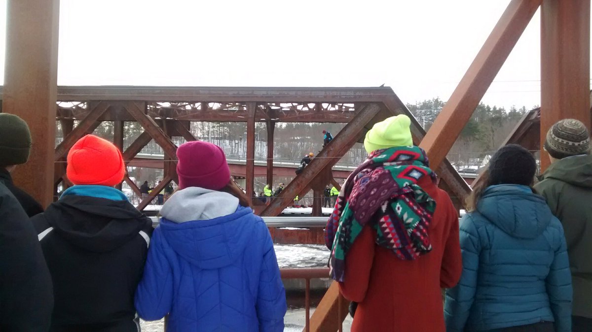350nhaction's tweet photo. Climbers on the bridge have been handed life vests. A rescue crew is ascending the bridge. The train has not moved. We must end burning of coal in New Hampshire. #NoCoalNoGas #CloseBow #BlockadeParty https://t.co/iXKKqRvKOS