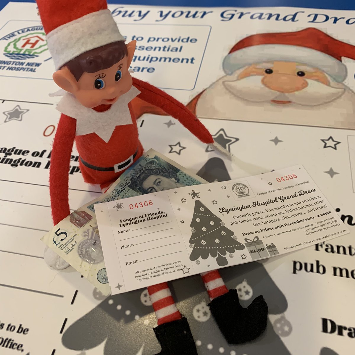 LymHospFriends's tweet photo. #SouthernElf popped into Lymington Hospital to support their Xmas Raffle ... if he wants these tickets he needs to let go of his fiver. https://t.co/CQlQcaSysZ
