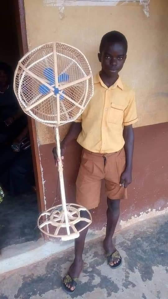 Ga_sasira's tweet photo. This 15-year-old boy makes wooden standing fans all by himself in the space of 2 days. 

Can we retweet and get this potential engineer some recognition.
#ruralscience 
#africangiant https://t.co/DhllRoYP85