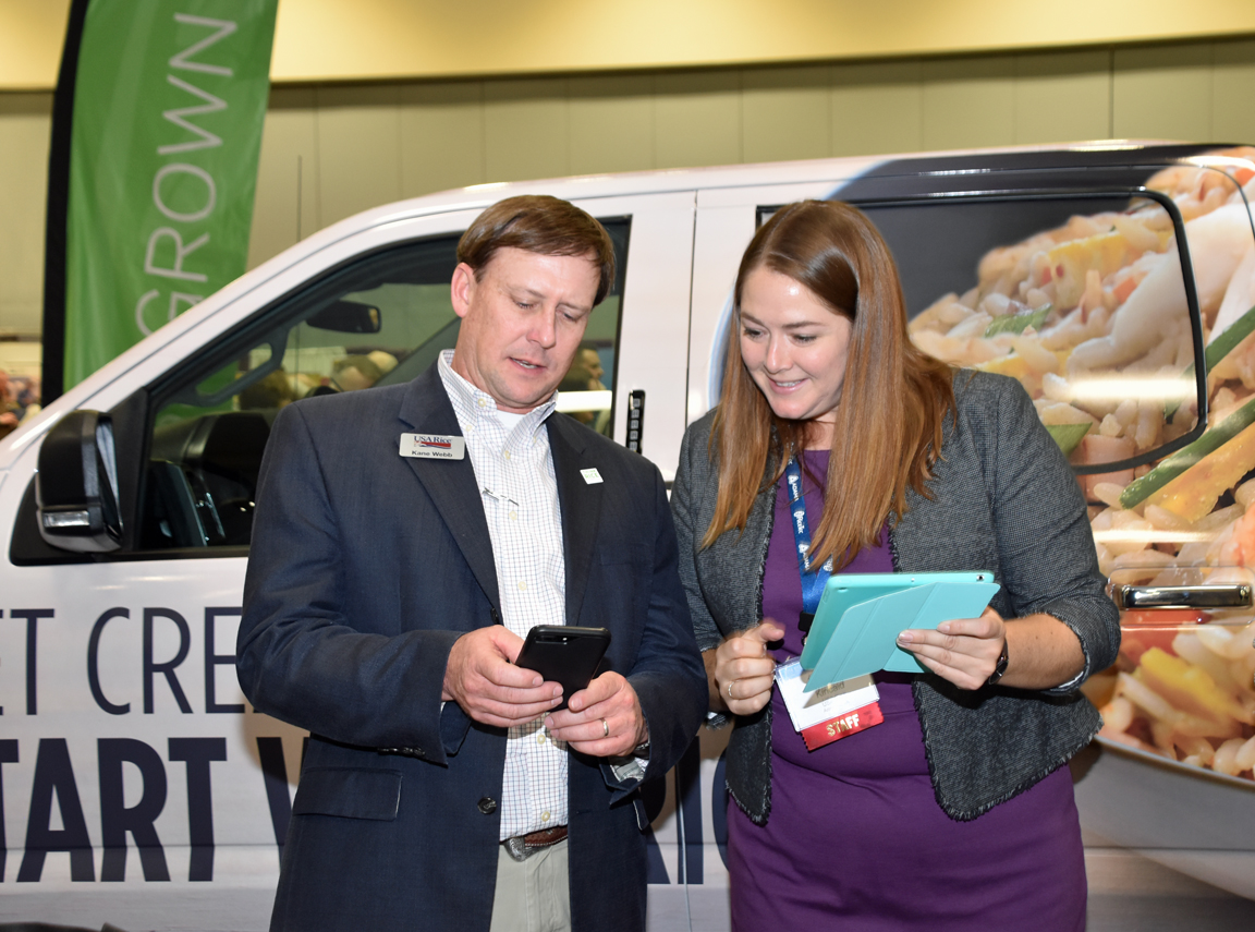 RiceFarming's tweet photo. Kane Webb of USA Rice's Louisiana office (left) checks on the latest raffle ticket sales for the #RideWithRice truck give-away. Some lucky person will win this truck during the Tuesday drawing #thinkrice #riceOutlook19 https://t.co/3nbKtKgue0