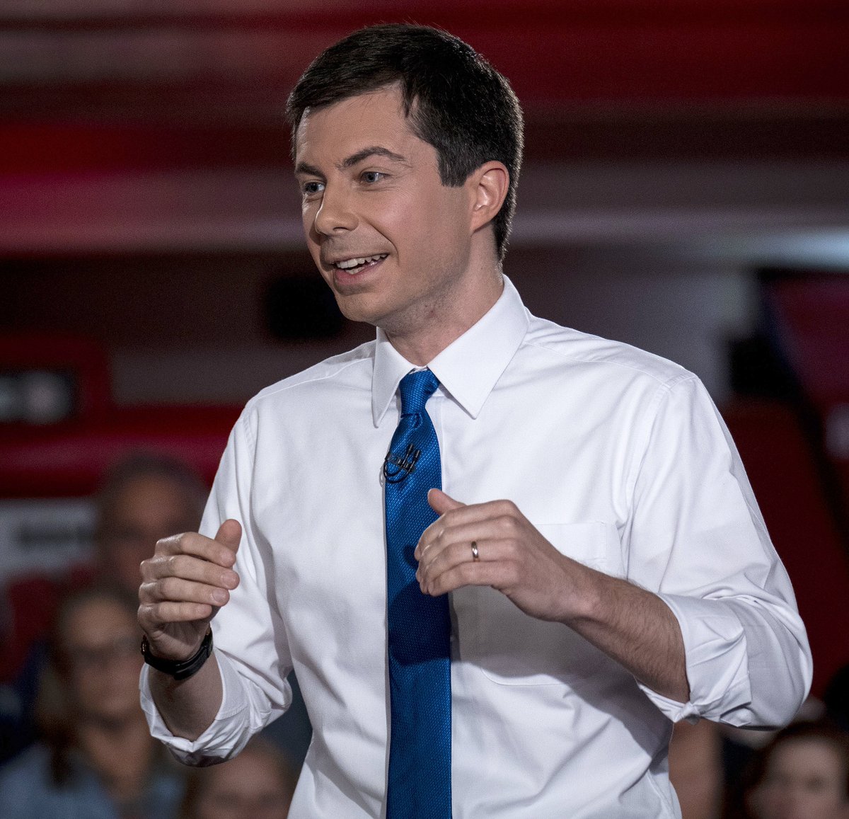 Pete Buttigieg looks like an overly-enthusiastic waiter at the Cheesecake F...