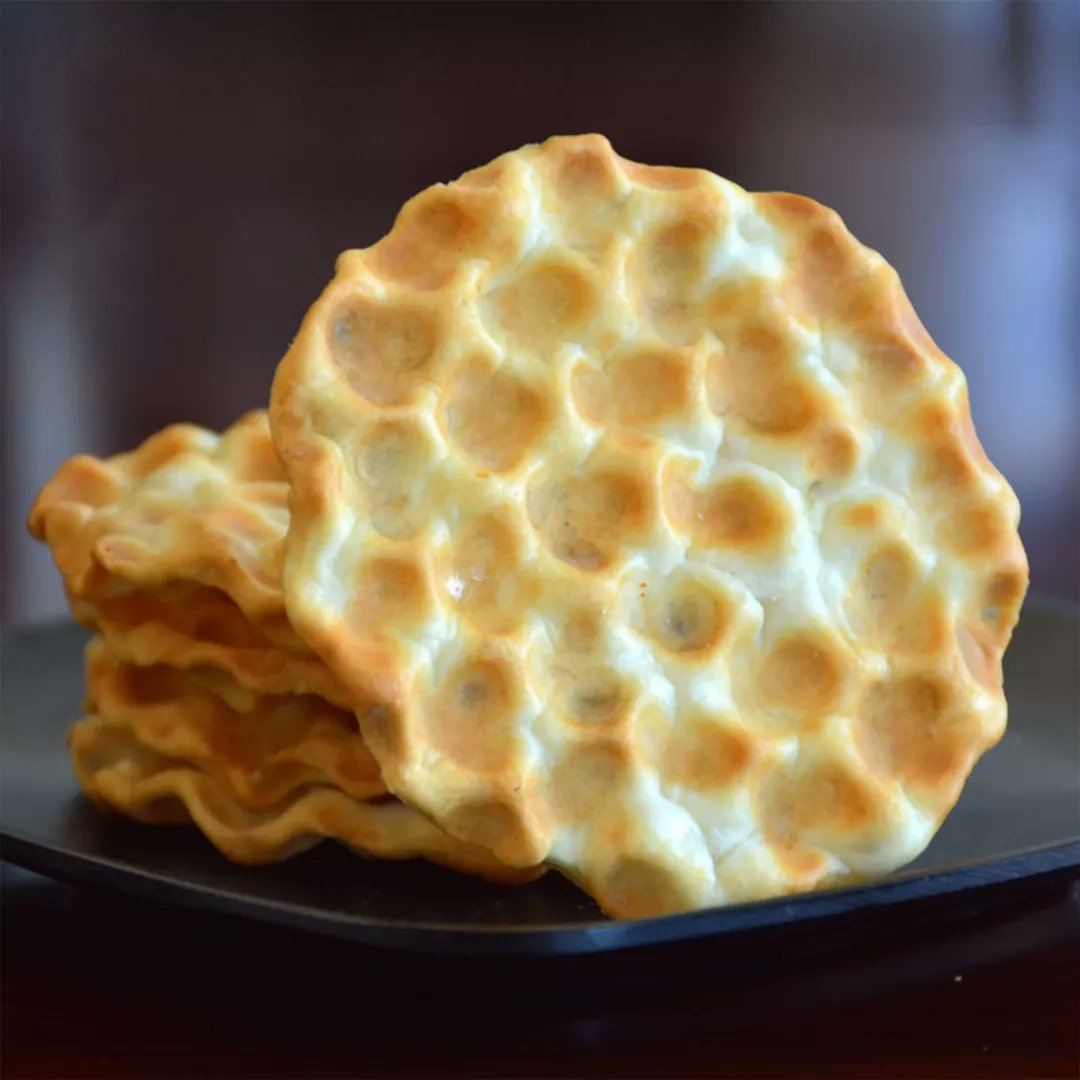 OTOP_CHINA's tweet photo. Called the “Living Fossil of Chinese Food”, Shaanxi Province’s stone cakes can be traced back to the Stone Age. Baked on a bed of hot stone, they taste like crunchy savory biscuits, full of the aroma of whole grains. (Image Credit: network) #OTOP #cookielover #snacklove https://t.co/6abnCagY9v