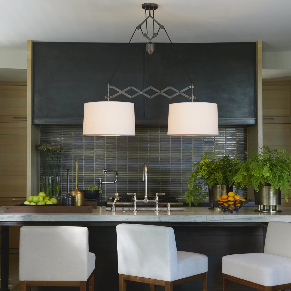 ArteriorsHome's tweet photo. An impressive island piece, the "Pantograph Pendant" by #RayBoothDesign employs tension & balance—perfectly staged over a long table or island to emphasize its linear form. https://t.co/A9yiGUZvUq