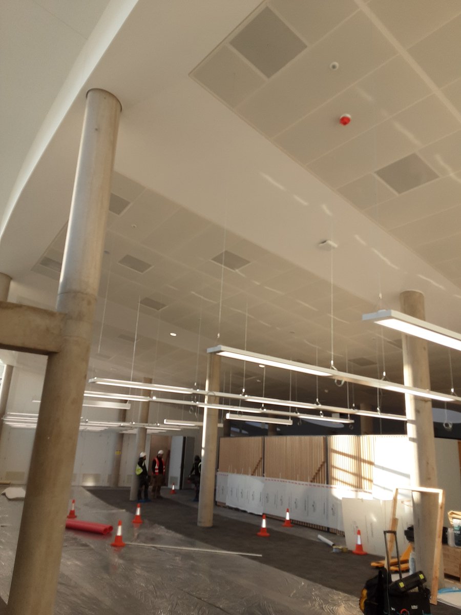 Another image showing SAS International 1800 x 600 ceiling system being installed at Liverpool John Moores University Avril Robarts building.