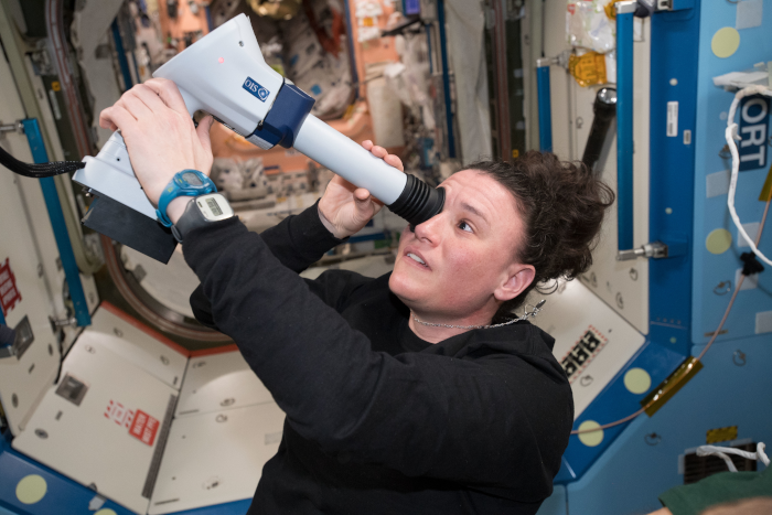 NASA astronaut Serena Auñón-Chancellor conducts an eye exam aboard the space station, part of ongoing crew health maintenance activities. Credits: NASA