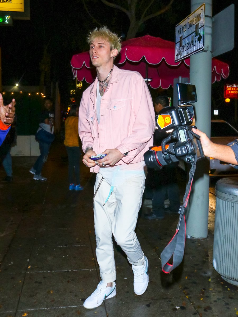 MTV's tweet photo. .@machinegunkelly in a pink jacket?? I'll take 3,000 copies of these pics, pls!! 👀 https://t.co/gBJAUpBH38