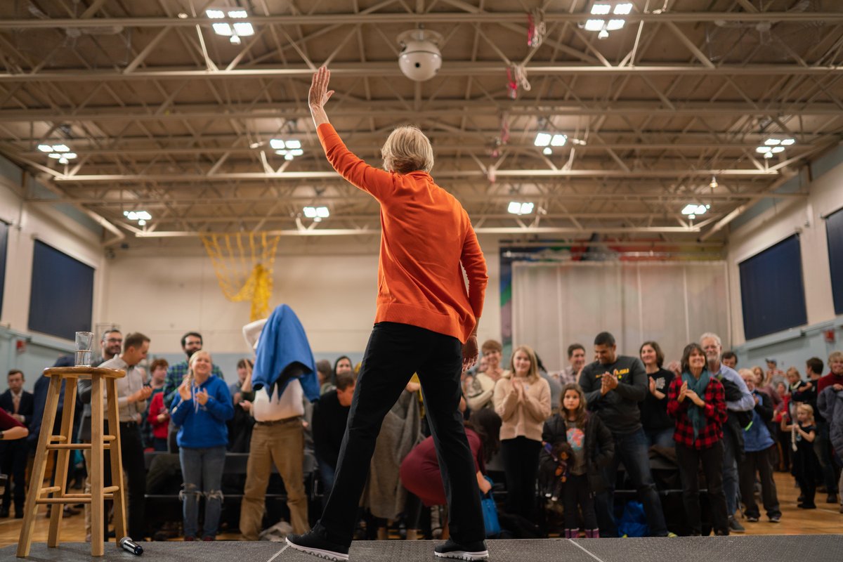 Elizabeth Warren walks onstage at the Rye town hall.