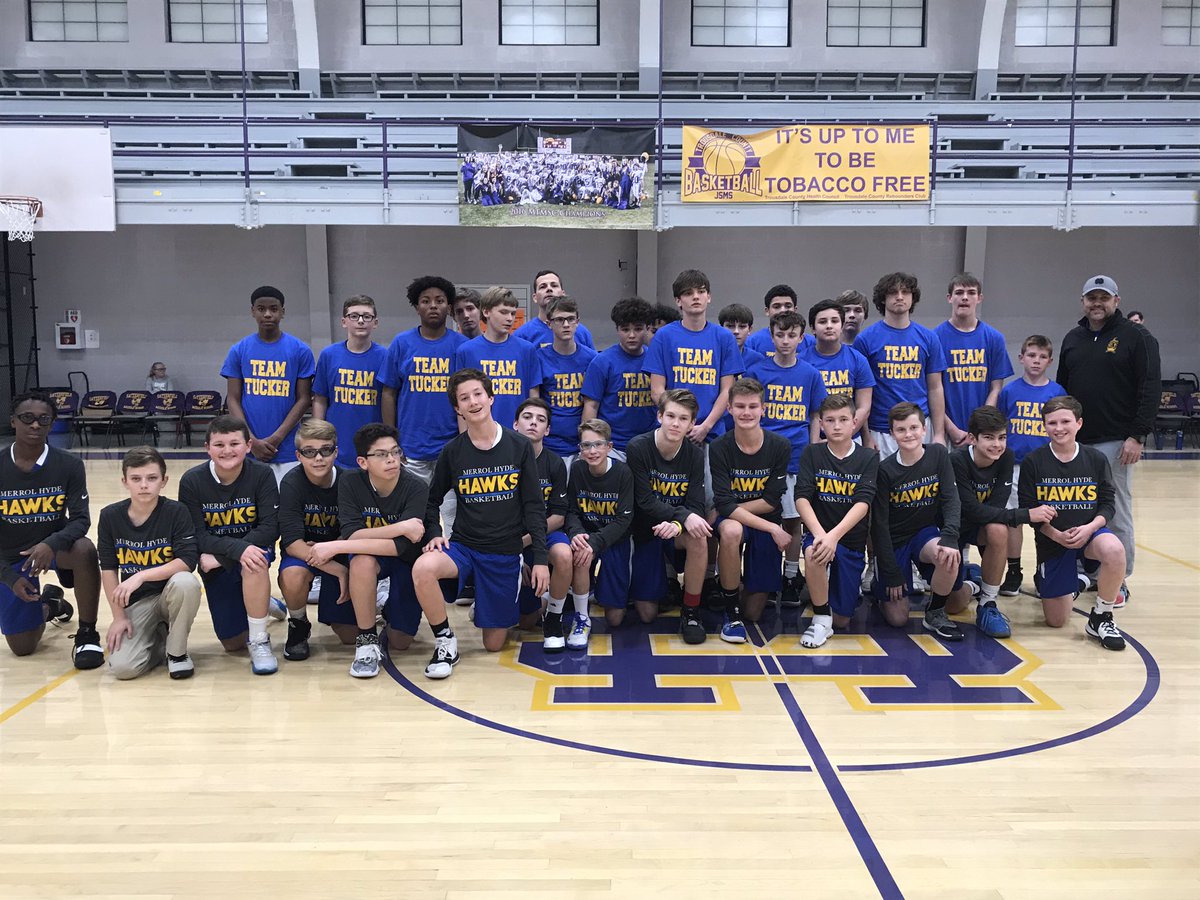 Middle school boys team takes the floor with Jim Satterfield Middle School before the game. JSMS players and coaches demonstrate the game is bigger than the score with their tribute to “Team Tucker”
