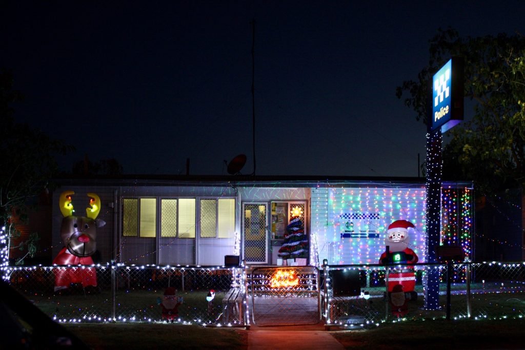 QldPolice's tweet image. Boulia officers have been busy getting ready for Santa’s arrival. The station display includes inflatable Santa's, over 650m of lights, projectors and QPS themed Christmas trees. Thanks for spreading the Christmas cheer Boulia! 🎄🎄More here: mypolice.page.link/Kewd #myPolice