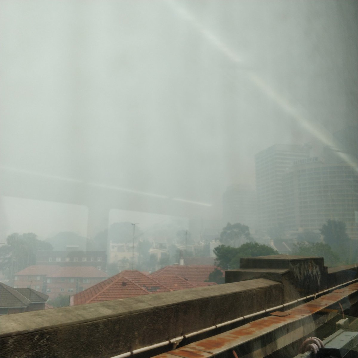 aidanbwilson's tweet photo. Visibility in Sydney down to about 100m, smoke had also triggered the smoke alarms at North Sydney station and Opal gates aren't working. #AustraliaBurns #sydneysmoke #bushfiresNSW https://t.co/uWAuKHY5NR