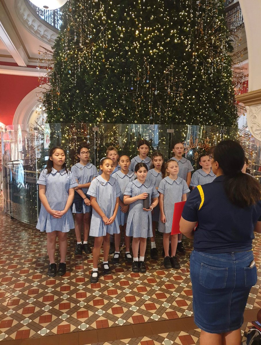 Students singing Christmas Carols at the Queen Victoria Building