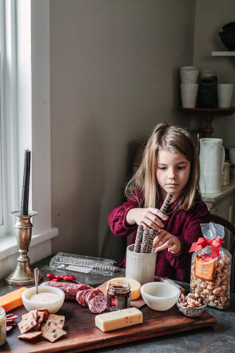 The girls LOVE to help set up cheeseboards; we had a blast setting up this Ultimate Charcuterie Experience Gift Basket from <a href="/HickoryFarms/">Hickory Farms</a>. I love teaching them about texture and color and how to arrange everything artfully. #HickoryForTheHolidays #HickoryFarmsPartner