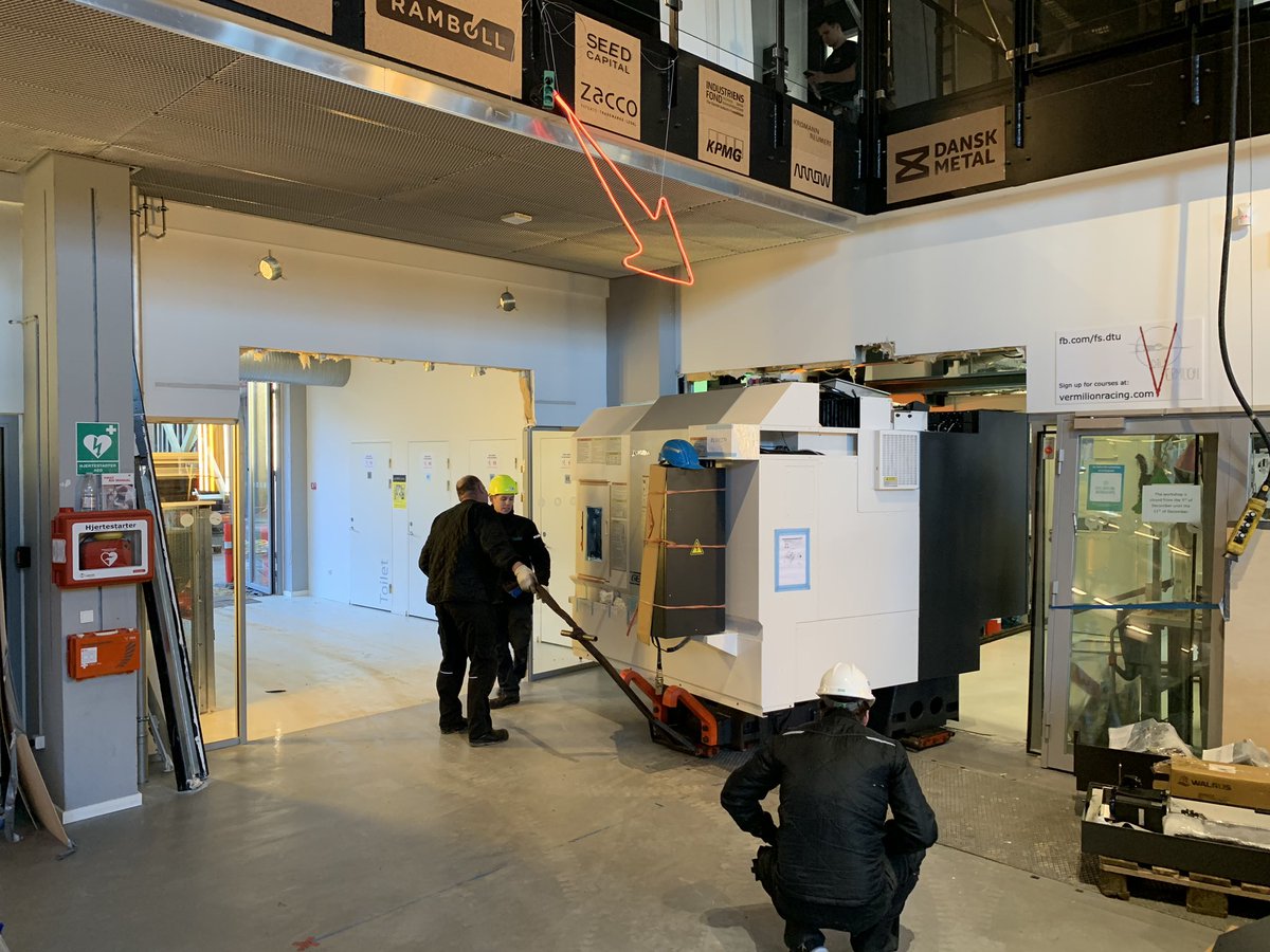 DTUSkylab's tweet photo. Another day at DTU Skylab: New CNC cutter just arrived. Had to cut a few holes in the wall to get it into the workshops though. @dtutweet #dtuskylab #innovation #workshops https://t.co/53IJkYHbaM