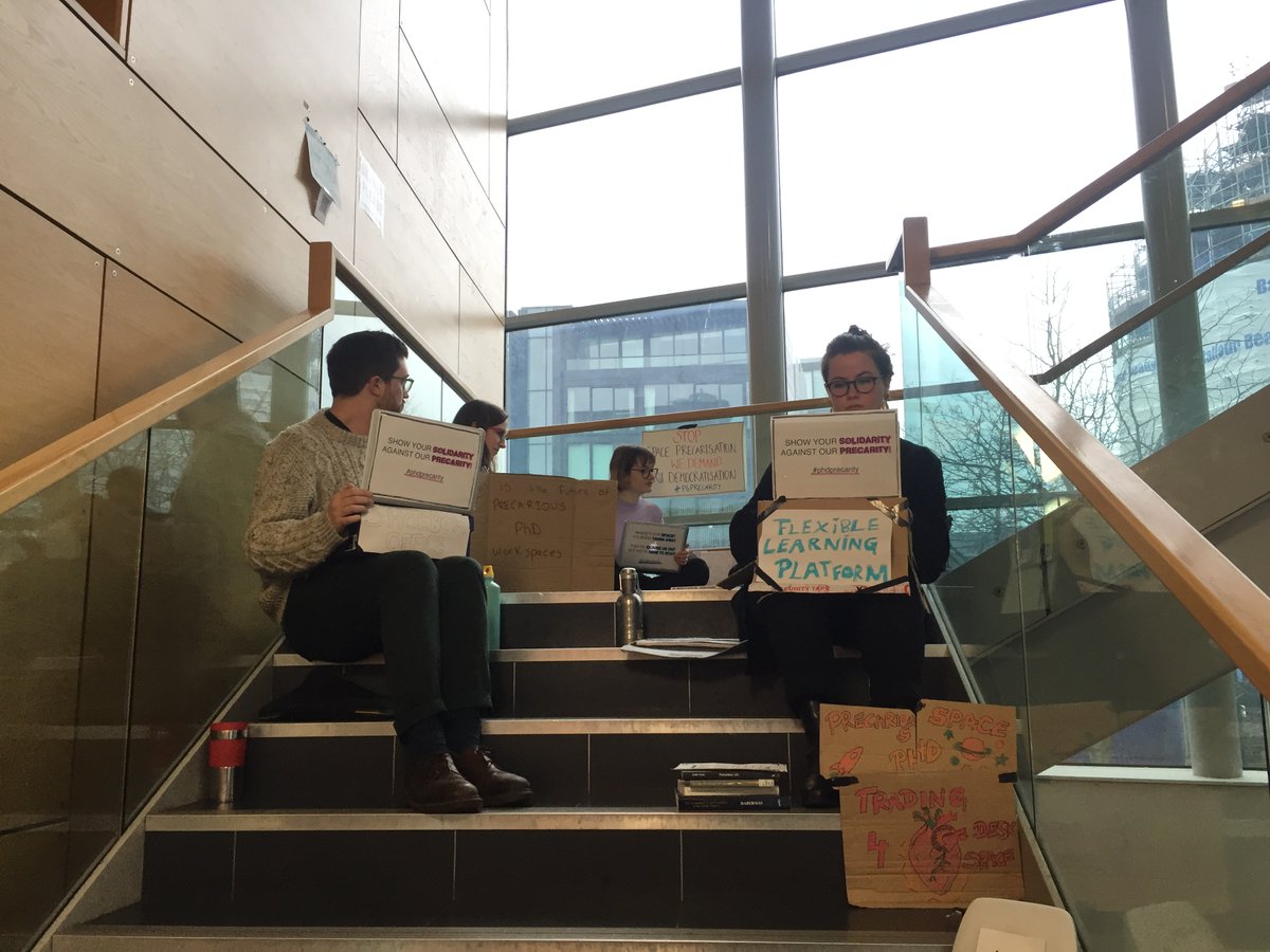 ucuedinburgh's tweet photo. Students at @uoessps are staging a sit-in to protest their hot desk spaces being cut from ~50  to ~20 for 1st and 2nd-year soc sci students. This decision allegedly came from surveilling Ph.D. student internet usage to monitor how much they use their office spaces #phdprecarity https://t.co/sWJvXDsy7d