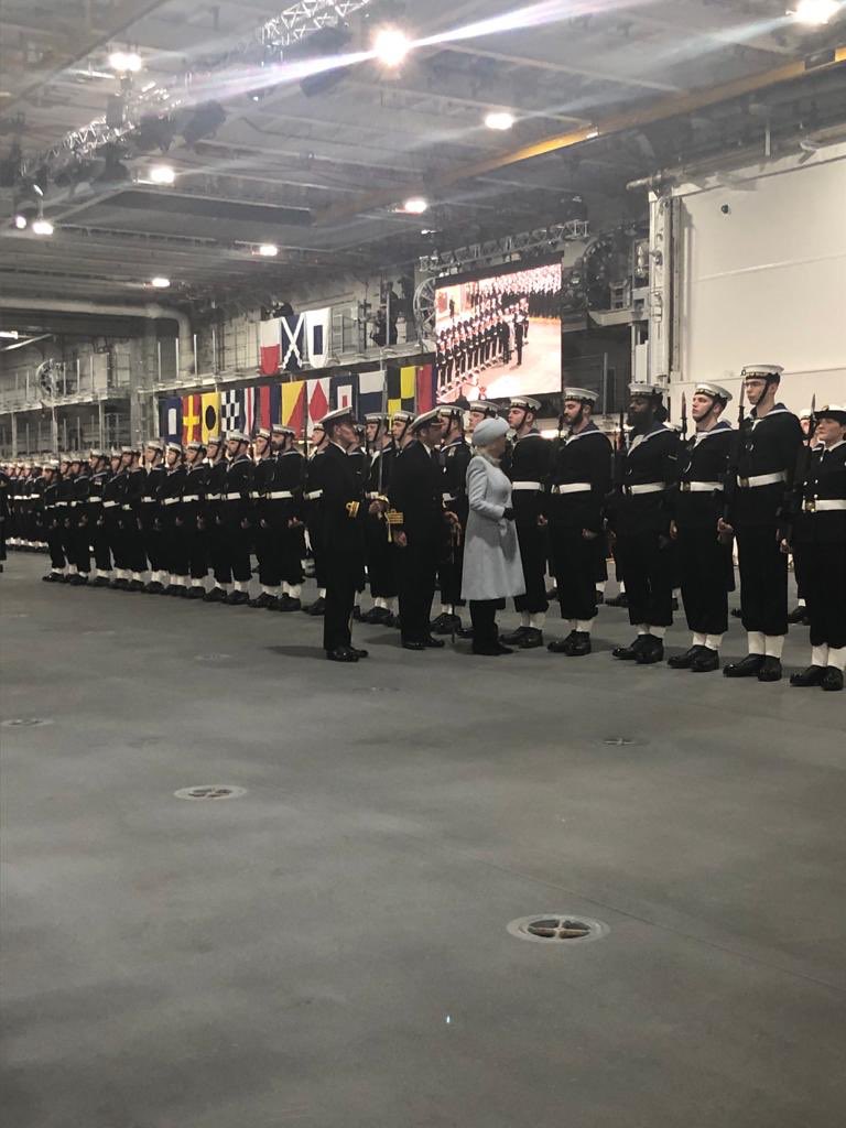 HMNBPortsmouth's tweet photo. HRH The Duchess of Cornwall inspects the Royal Guard at #pwlscommissioning ceremony. #carriertaketwo @HMSPWLS @RoyalNavy @ClarenceHouse https://t.co/RKuf2tPyPE