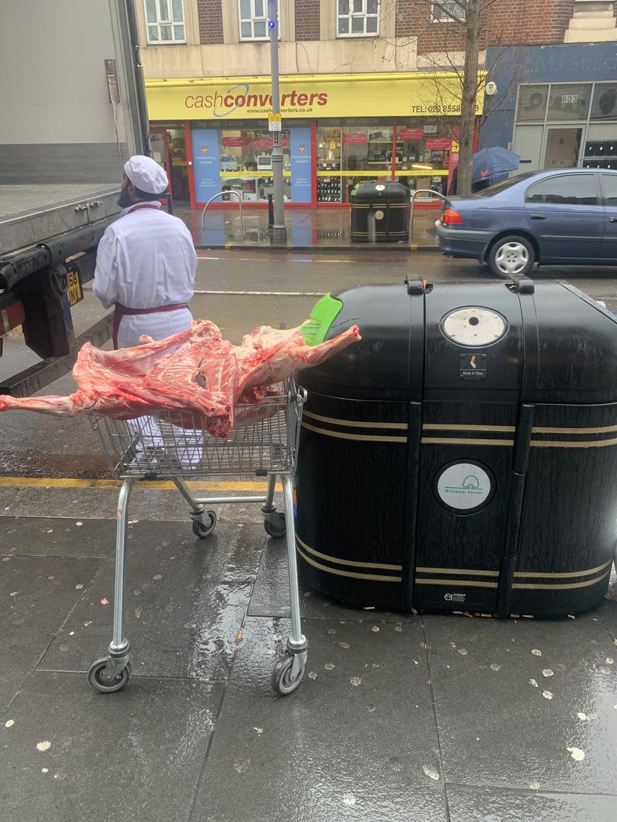 Is this company policy to load raw meat onto trolleys in the rain next to the bin? @TariqHalal 🥴. Never buying from you again