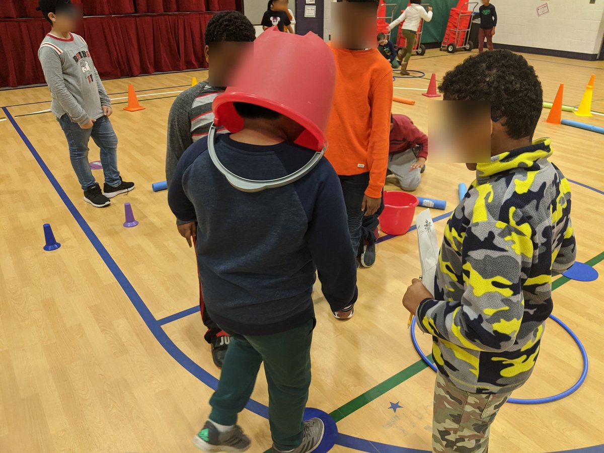 4th grade PE doing a robot coding relay to continue hour of code week. Students design their own course, then code their "robot" through. #apscodes #apsstem #apshpe