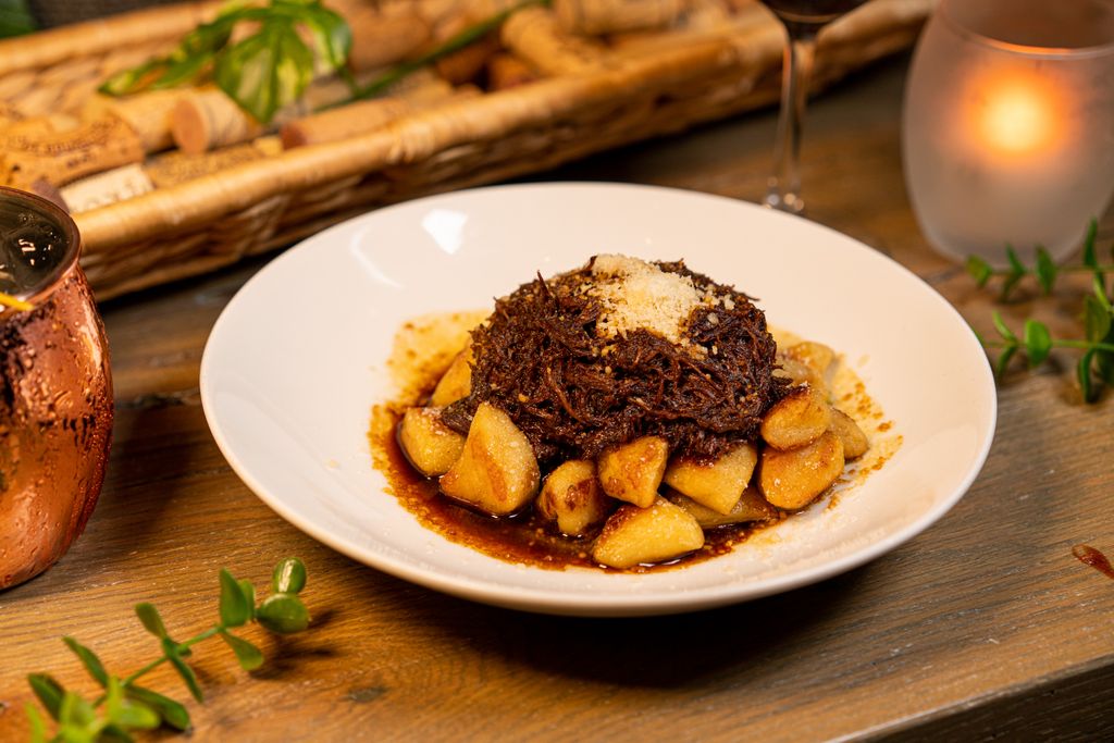 Comfort food elevated: Ricotta Gnocchi with braised short rib and pea purée. #crushmgm