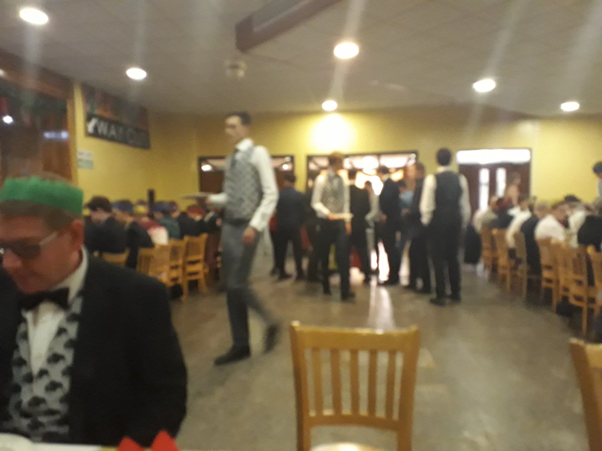 DuffusHouse's tweet photo. Always a lovely occasion at the Duffus Christmas Supper in the refectory. Great to see the boys looking so smart and the year 13s serve the house their turkey! Thank you to all the guests who attended, including Headmaster @titus_edge. #proudduffus #yum #crackerfun https://t.co/OdOVRETt1S