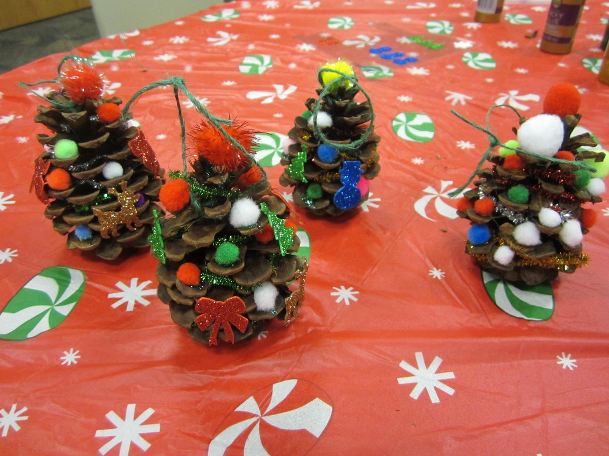 GrCalLibrary's tweet image. Simple pine cones transform into festive trees--or even reindeer! #AllAbility #LibrariesAreForEveryone