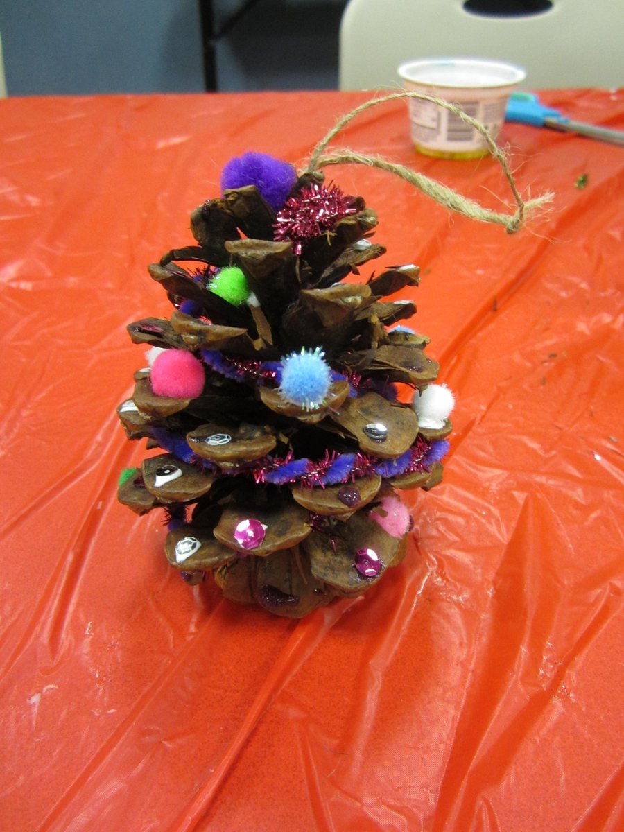 GrCalLibrary's tweet image. Simple pine cones transform into festive trees--or even reindeer! #AllAbility #LibrariesAreForEveryone