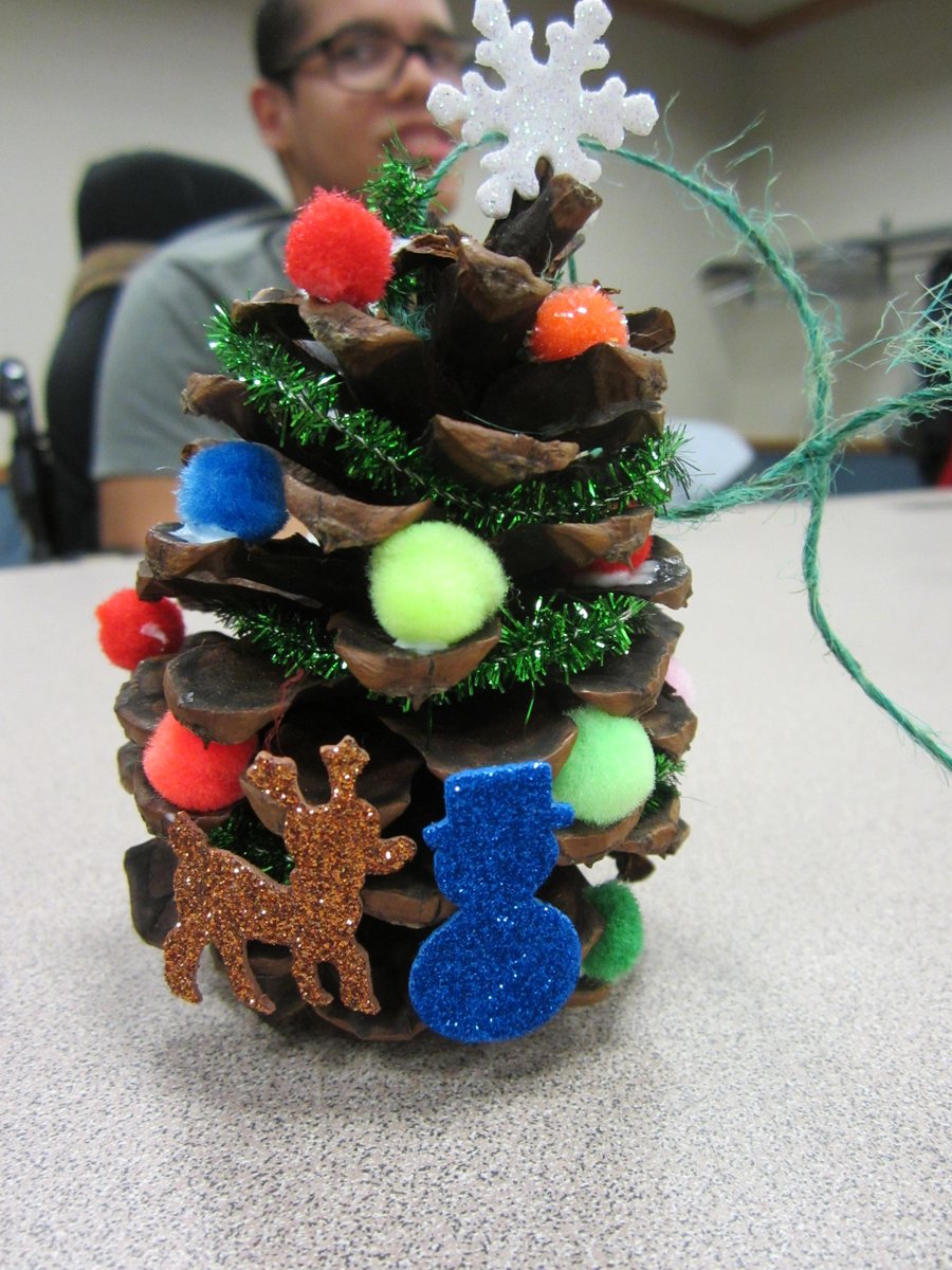 GrCalLibrary's tweet image. Simple pine cones transform into festive trees--or even reindeer! #AllAbility #LibrariesAreForEveryone