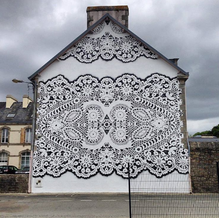 Polish artist NeSpoon from Warsaw, known for her street art featuring traditional lace pattern imagery #womensart