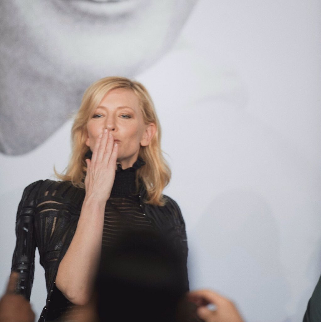 Cate Blanchett touching her lips, a thread.