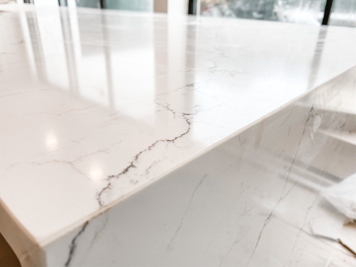 HGC_Designbuild's tweet image. This kitchen from our #baysideproject is definitely a work in progress, but it’s going to be a stunner when it’s finished. The veining in this waterfall countertop being installed is 👌and makes us So. Darn. Happy!