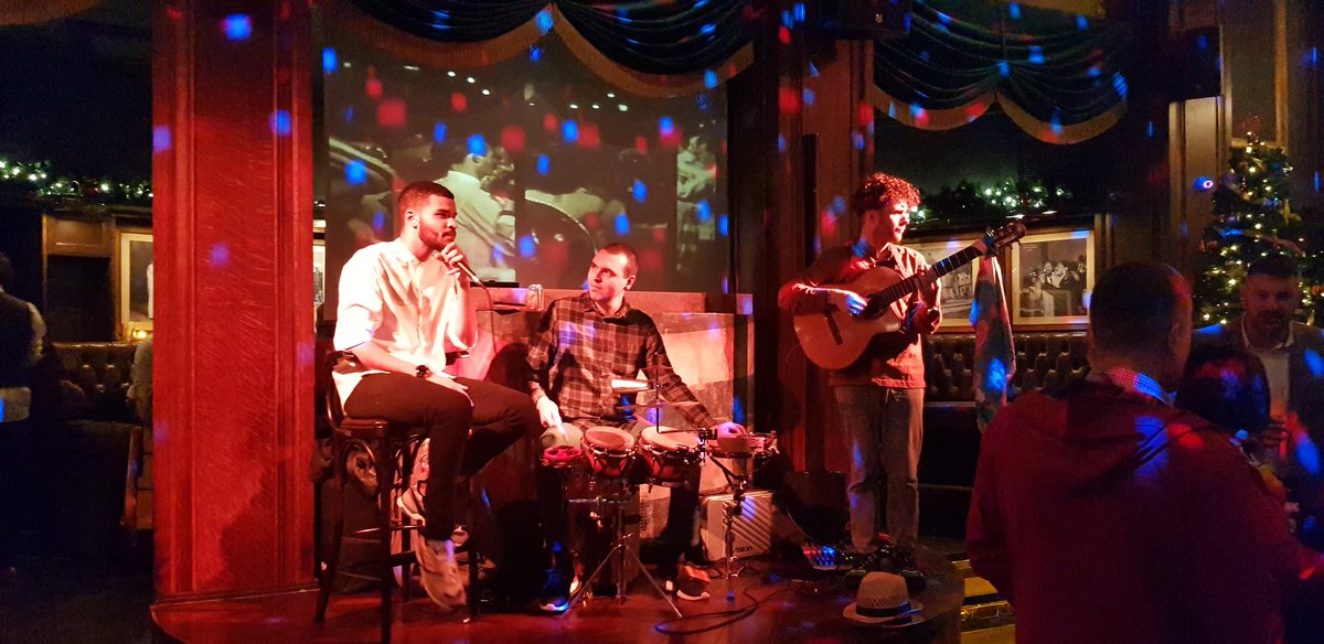 The band is playing. People are dancing.  Drinks are flowing.