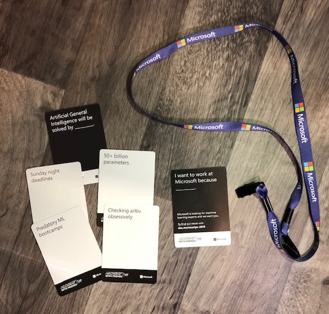 Alchemy with Friends cards laid out on the ground next to a Microsoft lanyard.