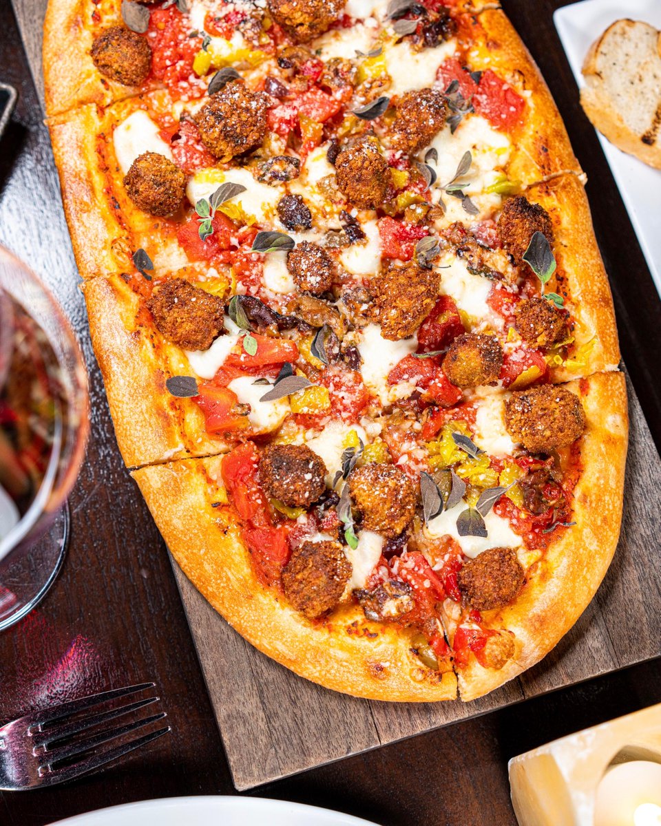 Perfect to share: Three Sausage Flatbread with chorizo, Italian, and andouille sausages. #lacavelv
