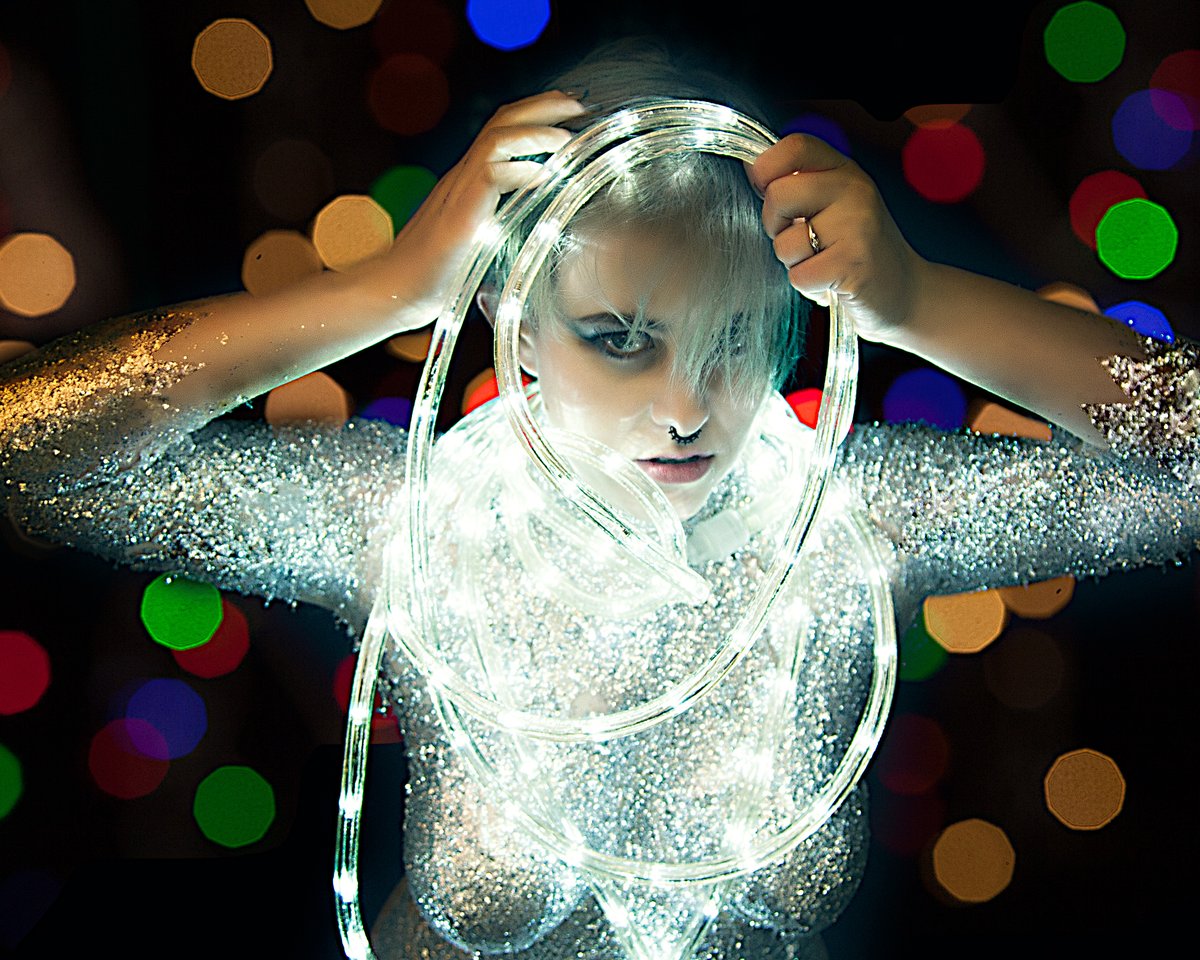 PhotoRP's tweet photo. Christmas Elf tangled up in the lights.  That's the spirit!!  Rachel Little with body painting and makeup with @moiragarrmua https://t.co/iqPjiNJl6E