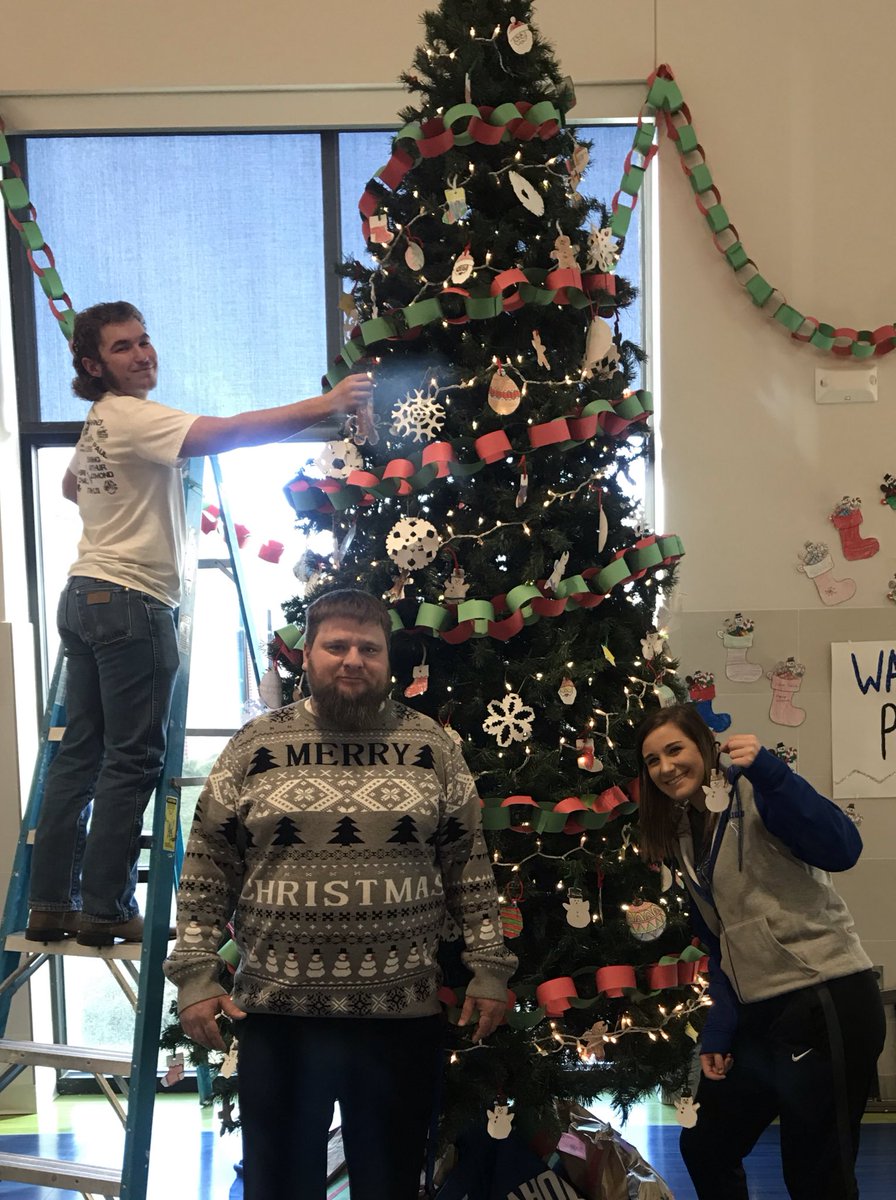 Day 7 of Sweatermas. Well, <a href="/terri_hilker/">Terri Hilker</a> and <a href="/cord_frink/">Cord Frink</a> think I’m a star and tried to put me on the Christmas Tree! #TheyAreNotUgly #BeAWarrior