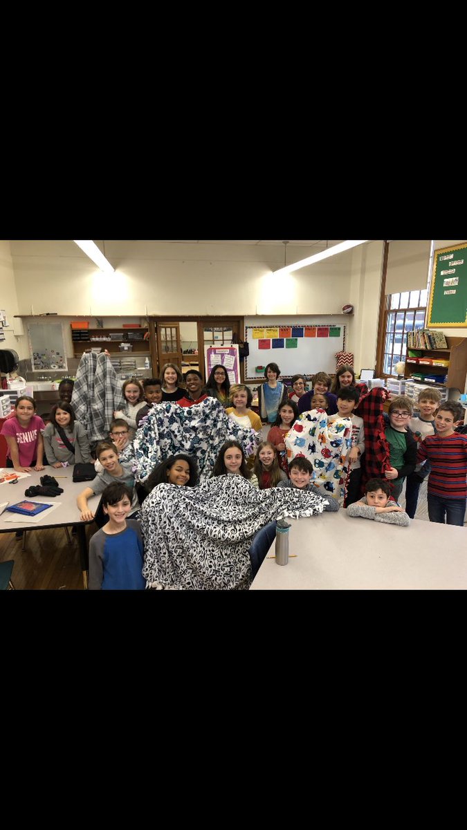 Woodbury Student Council members making blankets to donate to families in need!! They work so well together!! We have a great group!!