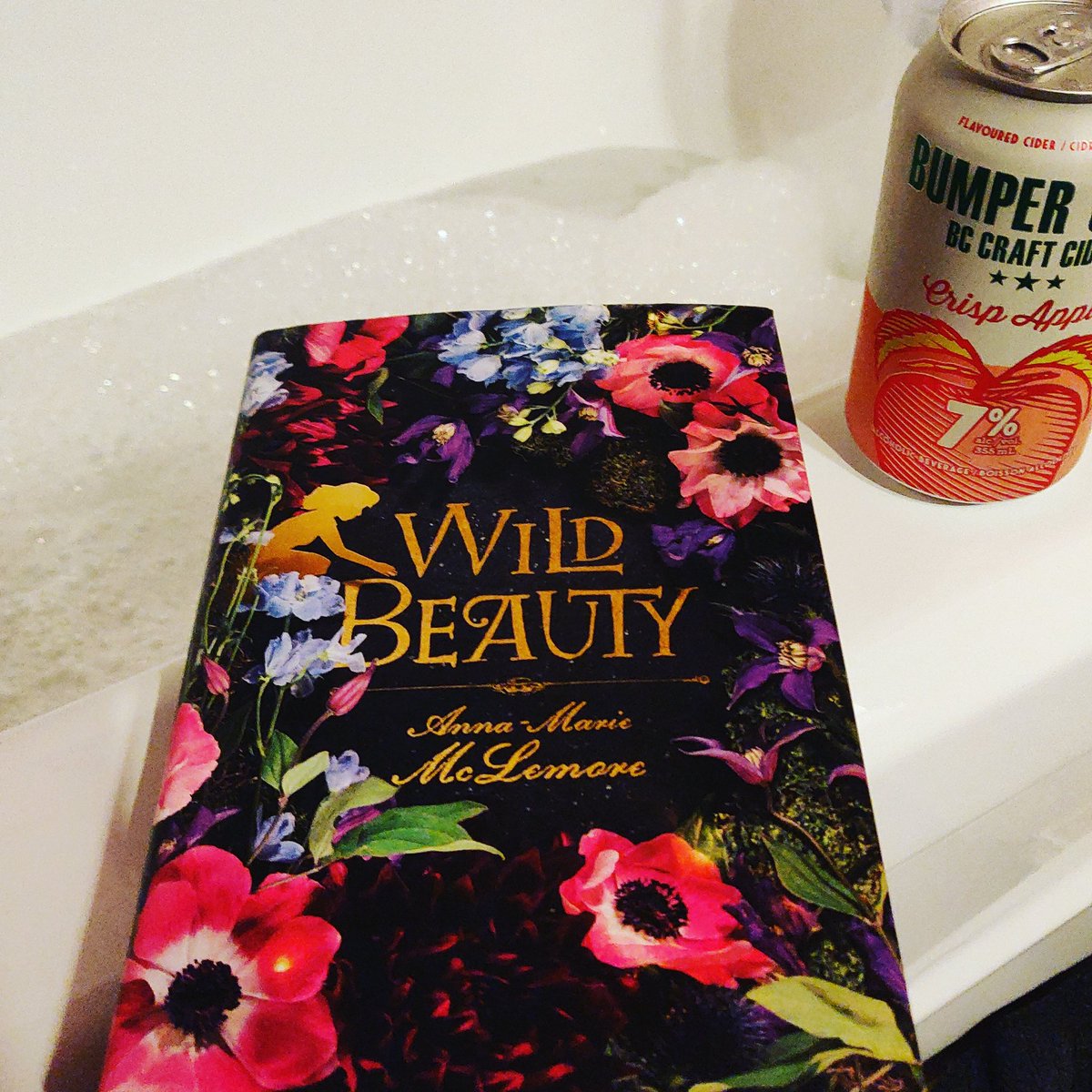 kathytrithardt's tweet photo. This week's #wednesdaytradition features Wild Beauty by Anna-Marie McLemore (aka the book I didn't quite have time to finish during that week's round of #queerlitread) and Bumper Crop Crisp Apple Cider. @queer_lit #bookbathandbeverage #booksandbaths https://t.co/bq0ucyvqbF