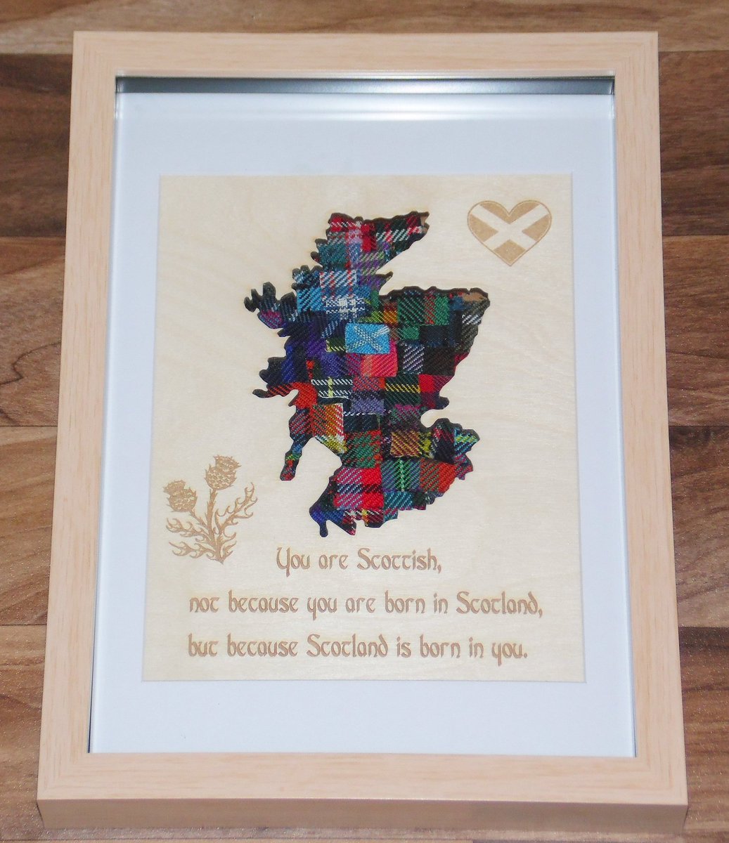 Picture of Kim's map, a map of Scotland filled with patchwork of tartans and writing...