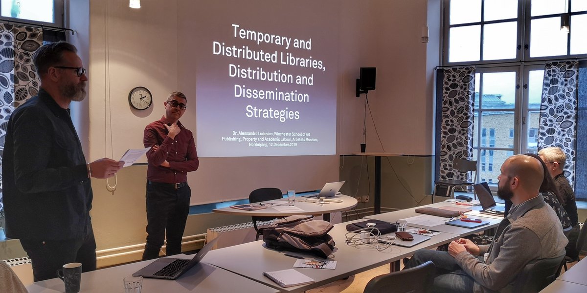 Prof. Jesper Olsson and Dr. Alessandro Lucovico in front of listeners.