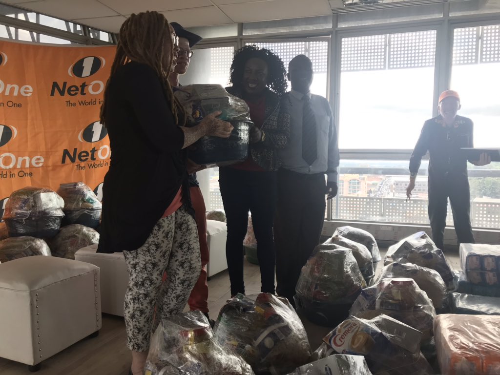 NetOneCellular's tweet photo. Head PR @ShereniDr hands over 100 food hampers and sanitary wear to people living with albinism and urges them to enroll on @OneMoneyZw platform as agents and earn commission. #CrossOver2NetOne #BePartOfTheNetwork @LazarusMuchenje @ShereniDr @muchagove @kuda_nyashanu https://t.co/ykfabuUCgF